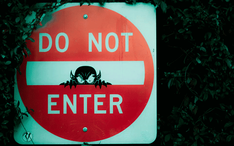 Do not enter road sign, with a demon chad peering out of the centre of the sign